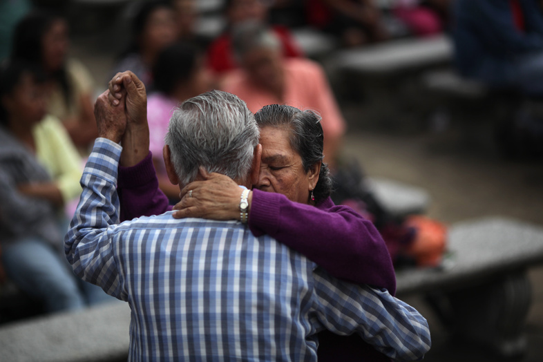 A couple dances in a park in Guatemala City – a country with a “culture of friendly people who are always smiling,” said surfing instructor Luz Castillo.