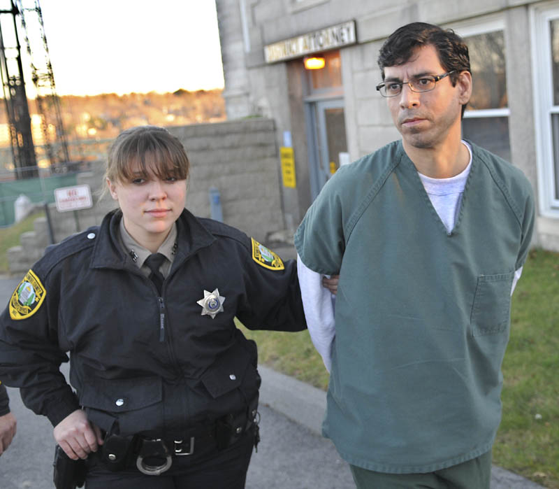 Michael Young, 41, is escorted to jail Thursday, after pleading guilty to manslaughter at Kennebec County Superior Court for the June 2011 stabbing of his domestic partner, David Cox, in Augusta.