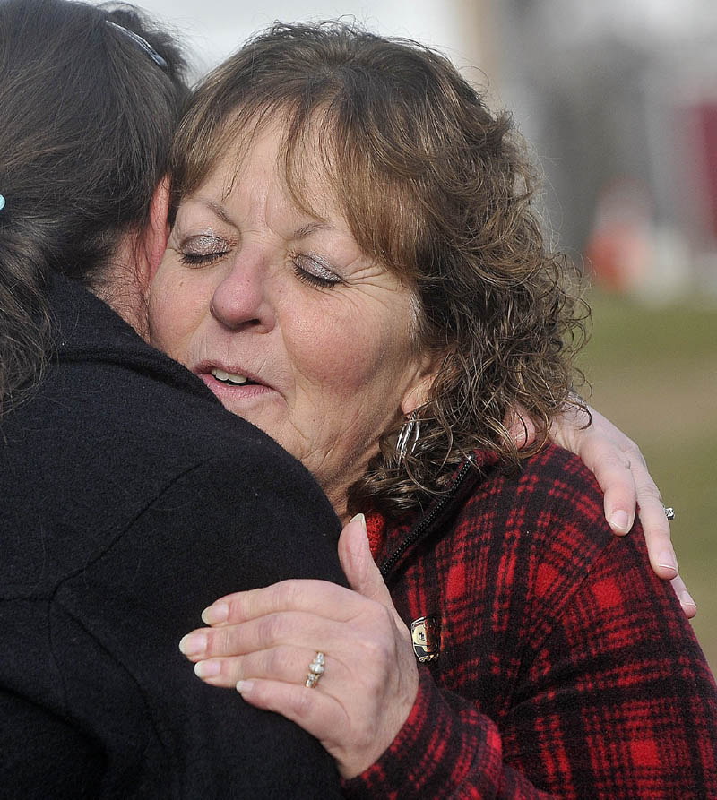 Christine Belangia, right, hugs Laurie Ann Robbins, left, following the sentencing of Jay Mercier at the Somerset County Superior Court House in Skowhegan on Friday, Dec. 7, 2012. Mercier received 70 years for the 1980 murder of Rita St. Peter.
