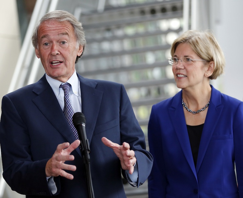U.S. Rep. Ed Markey, D-Mass., left, accompanied by then-Democratic Senate candidate Elizabeth Warren, speaks with reporters as Warren campaigned in Medford, Mass. Markey said Thursday that he plans to run for John Kerry's Senate seat if Kerry is confirmed as the nation's new secretary of state.