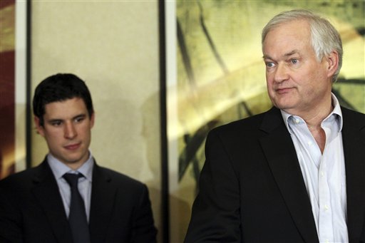 Pittsburgh Penguins' Sidney Crosby, left, listens as Don Fehr, executive director for the National Hockey League Players Association, speaks to reporters on Thursday, Dec. 6, 2012, in New York. Fehr said that he believed an agreement was close, only to change his position moments later when the NHL rejected the union's most recent offer.