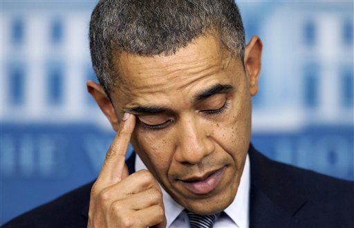 President Barack Obama wipes his eye as he talks about the Connecticut elementary school shooting, Friday, Dec. 14, 2012, in the White House briefing room in Washington. (AP Photo/Carolyn Kaster)