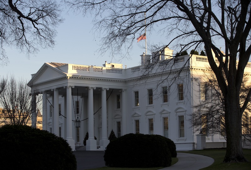 An American flag flies at half-staff over the White House in Washington, Friday, Dec. 14, 2012, in honor of the Connecticut elementary school shooting victims. (AP Photo/Charles Dharapak)