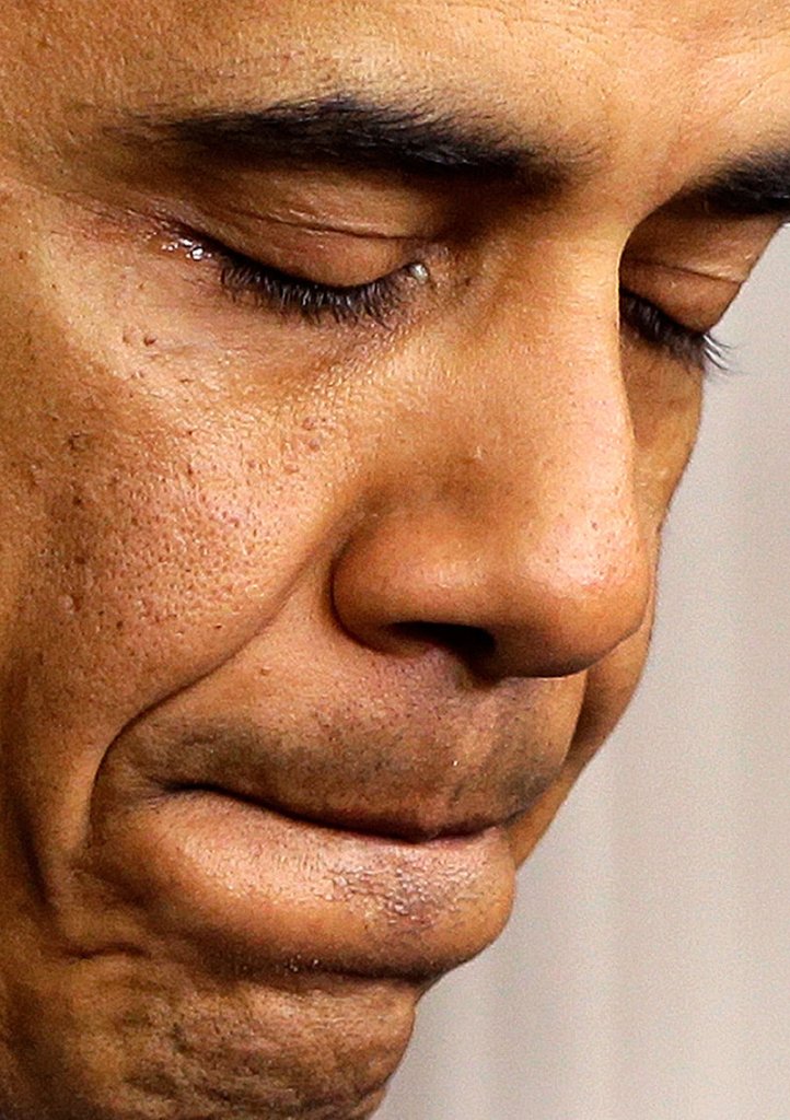President Barack Obama tears up as he speaks about the school shooting in Newtown, Conn., Friday, Dec. 14, 2012, in the briefing room of the White House in Washington. (AP Photo/Charles Dharapak)