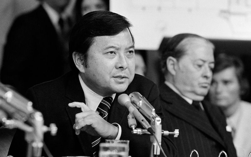 In this May 19, 1973 file photo, Sen. Daniel K. Inouye, D-Hawaii, a member of the Watergate investigating committee, questions witness James McCord during the hearing on Capitol Hill in Washington, as John M. Montoya, Democrat of New Mexico, is at right. Inouye, the influential Democrat who broke racial barriers on Capitol Hill and played key roles in congressional investigations of the Watergate and Iran-Contra scandals, died of respiratory complications, Monday, Dec. 17, 2012, according to his office. He was 88. (AP Photo/File) close;up;crime;hearing;investigations;listening;politician;politics;prominent;Japanese;Americans;senator;Watergate;scandal