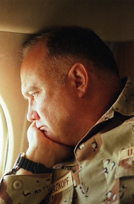 In this Jan. 13, 1991, file photo, Gen. H. Norman Schwarzkopf gazes from the window of his small jet on his way out to visit U.S. troops in the desert in Saudi Arabia.