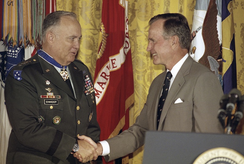 In this July 4, 1991, photo, President George Bush congratulates Gen. Norman Schwarzkopf after presenting him the medal of freedom at the White House in Washington. Schwarzkopf died Thursday in Tampa, Fla. He was 78.