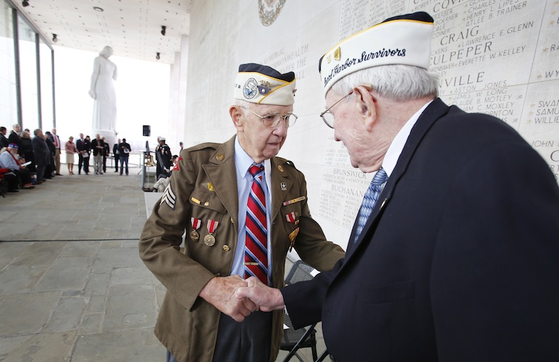 Pearl Harbor survivors Max Green, left, and Bill Thornton greet each other prior to the Pearl Harbor Day Remembrance Ceremony at the Va. War Memorial, in Richmond, Va. on Friday, Dec. 7, 2012. The ceremony remembers those Virginians who died during the Japanese attack on Pearl Harbor, Hawaii on December 7, 1941. (AP Photo/Richmond Times-Dispatch, Dean Hoffmeyer)