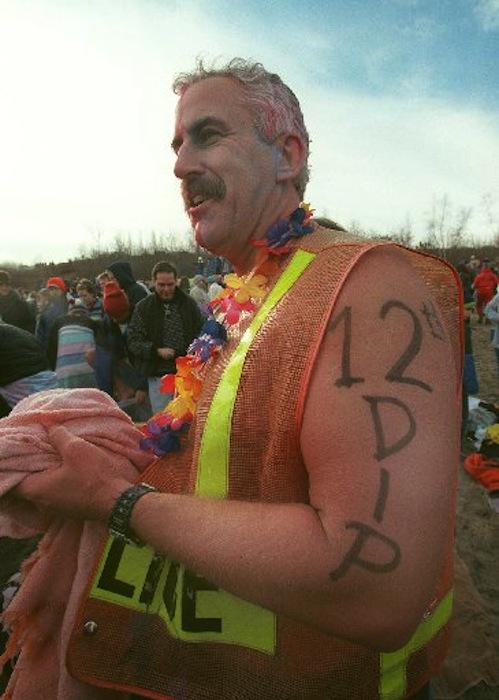 In this January 2000 file photo, South Portland police officer Peter MacVane participate in the 12th Annual Lobster Dip at East End Beach in Portland to raise money for the Maine Special Olympics. MacVane has died after a long battle with cancer.