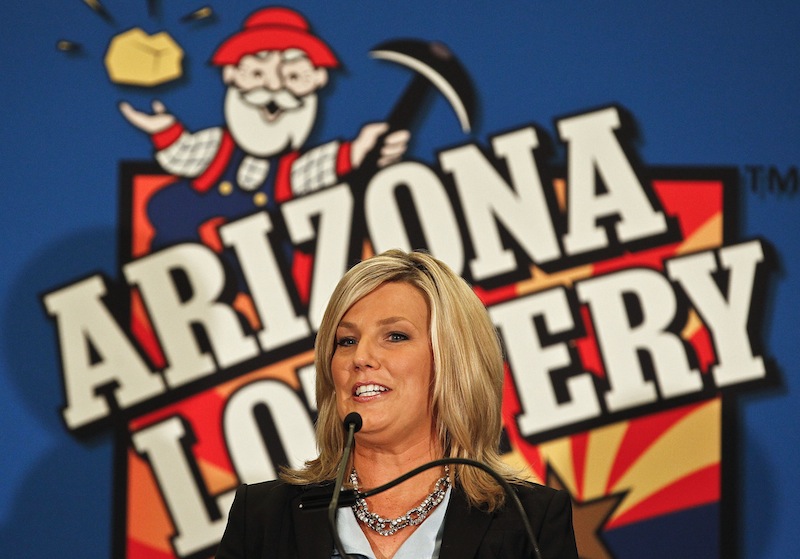 In this Nov. 29, 2012 photo, Karen Bach, Director of Budget, Products and Communications of the Arizona Lottery, announces during a news conference in Phoenix that one of the winning tickets in the $579.9 million Powerball jackpot was purchased in Fountain Hills, Ariz. The other ticket holders in last week's record $577.5 million Powerball jackpot have claimed their half of the prize but aren't stepping into the spotlight just yet, the Arizona Lottery said Friday, Dec. 7, 2012. (AP Photo/Ross D. Franklin, File)