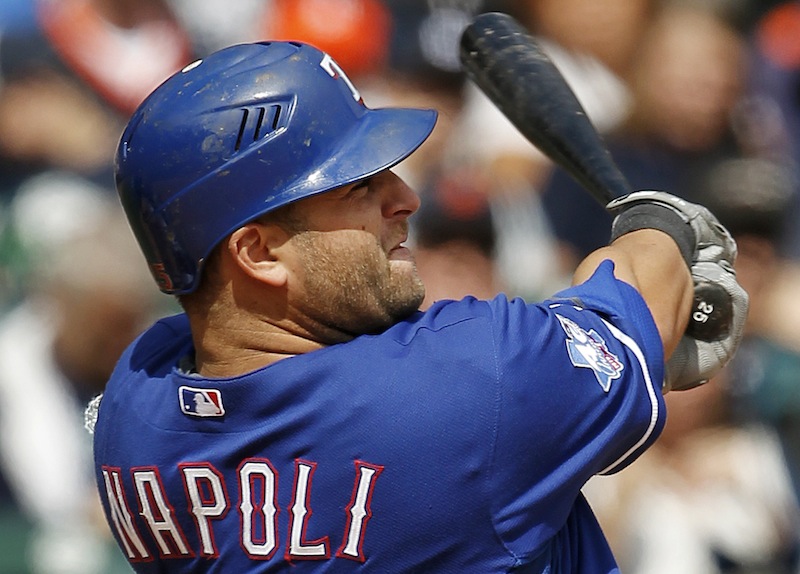In this April 21, 2012, file photo, Texas Rangers' Mike Napoli hits a solo home run against the Detroit Tigers in the ninth inning of a baseball game in Detroit. A person familiar with the negotiations says Napoli and the Boston Red Sox agreed to a $39 million, three-year contract Monday, Dec. 3. (AP Photo/Paul Sancya, File)