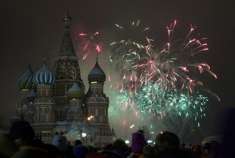 Fireworks explode in the sky over St. Basil Cathedral as Russians celebrate New Year on Red Square in Moscow, Russia, on Tuesday, Jan. 1, 2013. (AP Photo/Ivan Sekretarev)