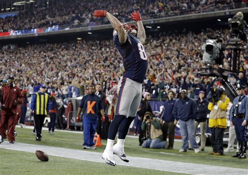 New England Patriots tight end Aaron Hernandez celebrates his touchdown catch against the Houston Texans during the second quarter of the NFL football game in Foxborough, Mass., Monday. Gillette Stadium