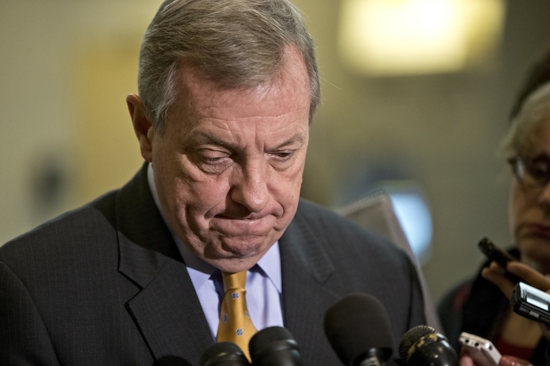 Sen. Dick Durbin, D-Ill., a member of the Senate Foreign Relations Committee, pauses as he speaks to reporters following a closed-door briefing on the investigation of the deadly Sept. 11 attack on the U.S. consulate in Benghazi, Libya, at the Capitol in Washington, Wednesday, Dec. 19, 2012. An Accountability Review Board's report indicates serious bureaucratic mismanagement was responsible for the inadequate security at the mission in Benghazi where the U.S. ambassador and three other Americans were killed. (AP Photo/J. Scott Applewhite)