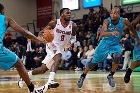 Shelvin Mack of the Maine Red Claws drives toward the basket as Troy Hudson of Sioux Falls moves in on defense Sunday at the Portland Expo. The Claws lost, 98-87.