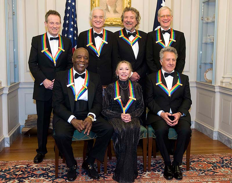 The 2012 Kennedy Center Honorees, from left, John Paul Jones, Buddy Guy, Jimmy Page, Natalia Makarova, Robert Plant, Dustin Hoffman, and David Letterman pose for a group photo after the State Department Dinner for the Kennedy Center Honors gala Saturday at the State Department in Washington.