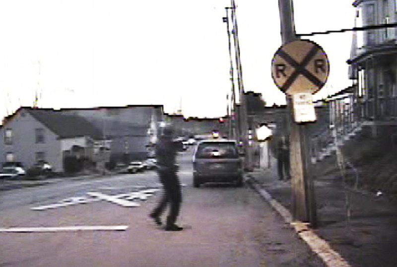 Biddeford Police Sgt. Jeffrey Greene orders Barbara Stewart to drop her weapon moments before he fatally shot her in this March 24, 2009, image taken from a cruiser video. Stewart advanced on Greene, pointing what appeared to be a semi-automatic handgun at him. According to the Office of the Attorney General’s investigative file, police later learned it was a pellet gun and that Stewart was intent on suicide.