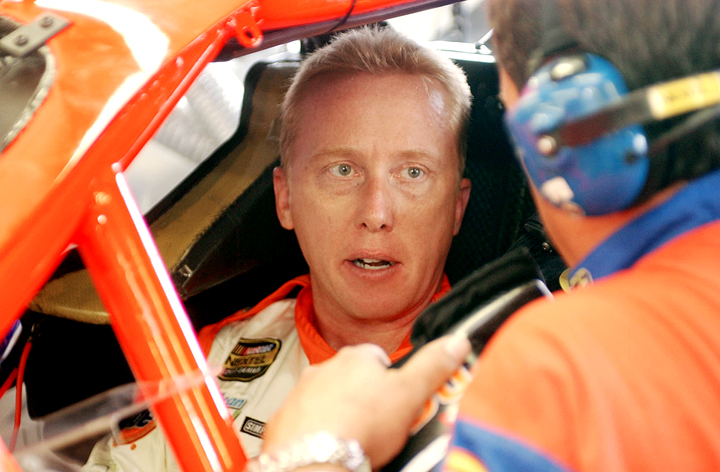 In this July 2004 photo, NASCAR driver Ricky Craven of Newburgh, Maine, talks with Doug Holbrook before practice for the Nextel Cup Siemens 300 at New Hampshire International Speedway in Loudon, N.H.