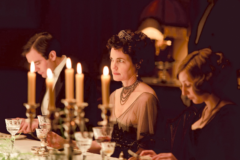 Elizabeth McGovern (center), who plays Cora Crawley, in an elegant upstairs dining scene from “Downton Abbey.”