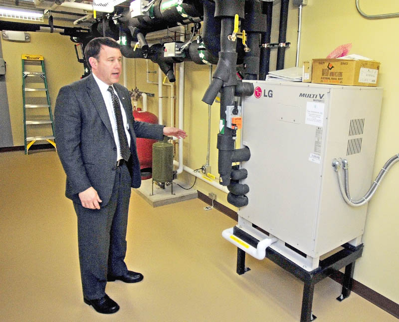 Executive Vice President Andrew E. Silsby talks about the heat pump system during a tour on Wednesday December 19, 2012 of the new Kennebec Savings Bank branch at the corner of Main and Northern Avenues in Farmingdale.