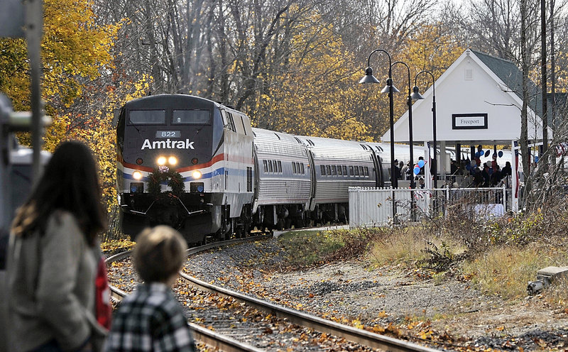 In this November 2012 file photo, the Amtrak Downeaster sits at Freeport Station, after a special ceremony, awaiting departure for Brunswick Station on its Inaugural run for service from Boston to Freeport and all stops between. Nearly twice as many people as projected rode Amtrak Downeaster’s new line to Freeport and Brunswick during its first month of passenger service, the Northern New England Passenger Rail Authority says.