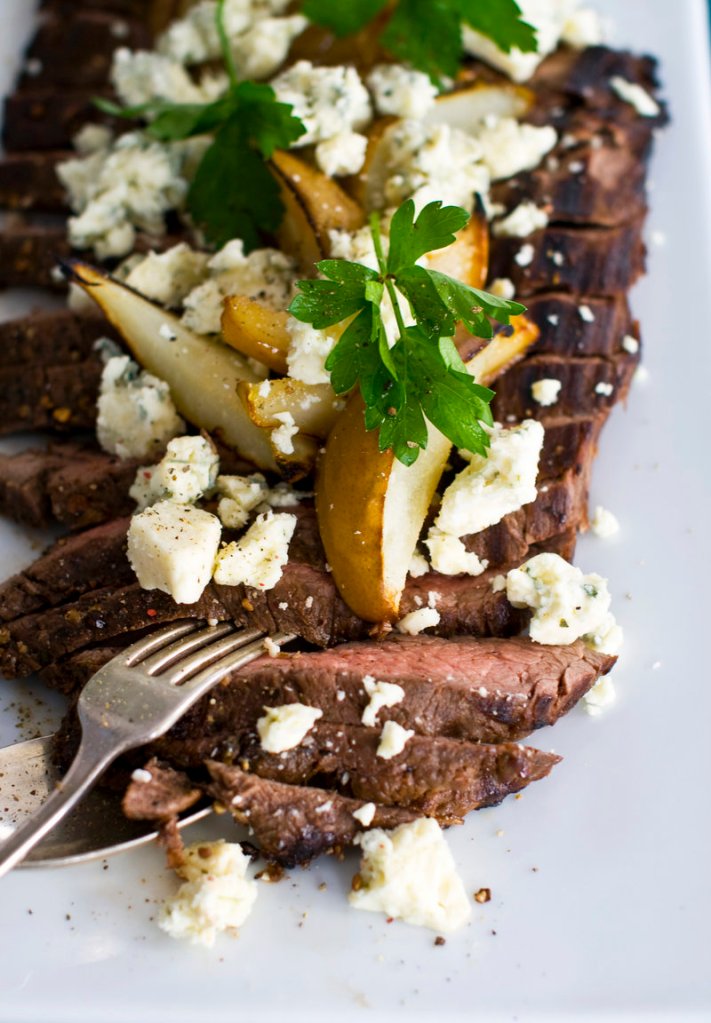 Balsamic-pepper flank steak with grilled pear and blue cheese is shown. The cut is meant to be lightly grilled or broiled. It also loves to be marinated.