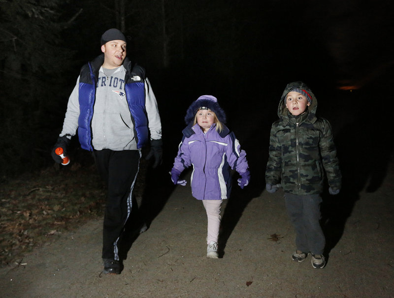 Jeremy Gray of Saco walks the trail with his children, 5-year-old Kayleigh and 6-year-old Faegan.