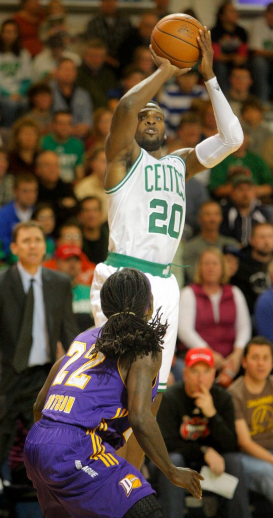 Shelvin Mack of the Maine Red Claws – who wore Boston Celtics uniforms for the game – shoots over Los Angeles defender Courtney Fortson in a 97-94 loss at Portland on Friday night.