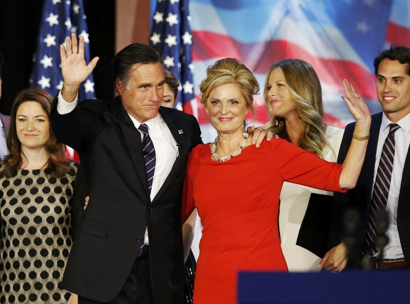 Republican presidential nominee Mitt Romney stands on stage with his wife, Ann, after he delivered his concession speech in Boston. Friends say the also-ran isn’t bitter about his loss. Bitterness “is not in the family genetic code,” said one. Friends say the loss has been harder on Ann, who they report has been crying in private.