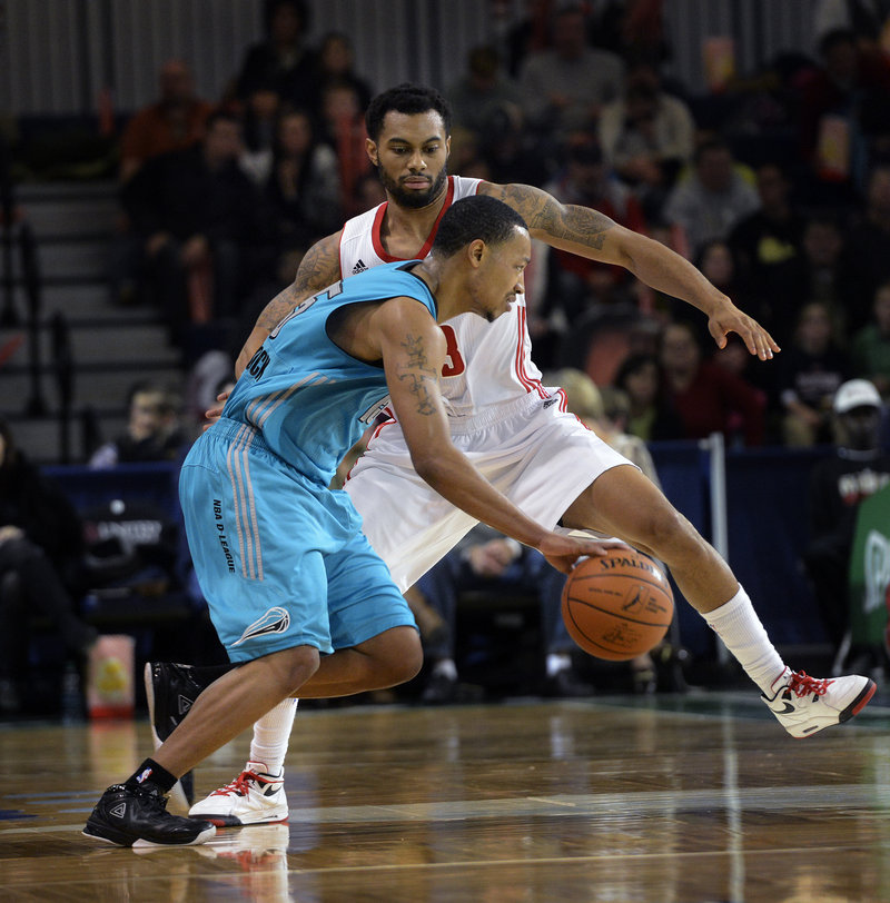 Xavier Silas of the Red Claws plays defense against Sioux Falls’ Andrew Goudelock, who scored 24 points for the visiting Skyforce during their 98-87 victory Sunday afternoon at the Expo.