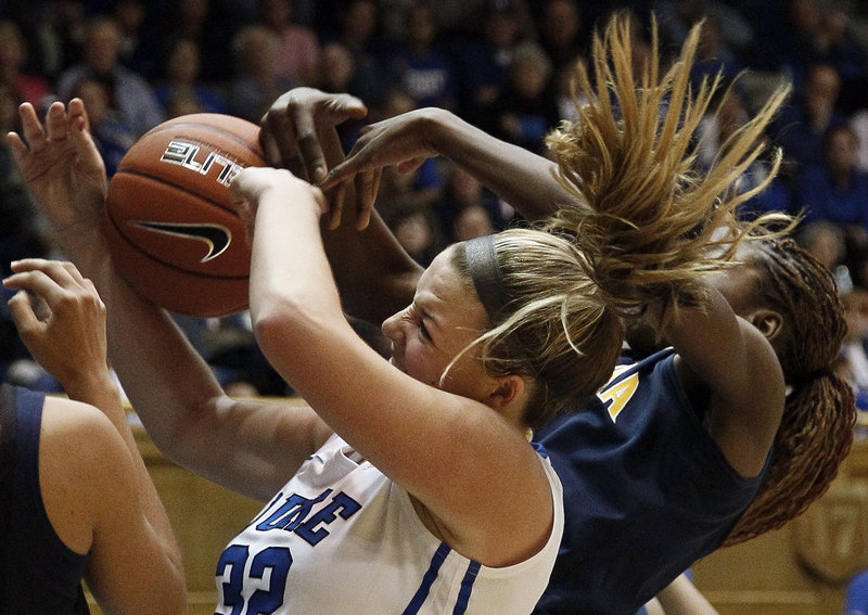 Duke’s Tricia Liston, left, struggles with California’s Gennifer Brandon for a rebound during the second half of Sunday’s game in Durham, N.C., won by the fourth-ranked Blue Devils, 77-63.