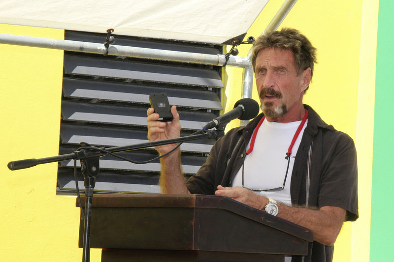 John McAfee, identified as a “person of interest” in the killing of his neighbor, speaks last month during a presentation at the San Pedro Police Station in Ambergris Caye, Belize.