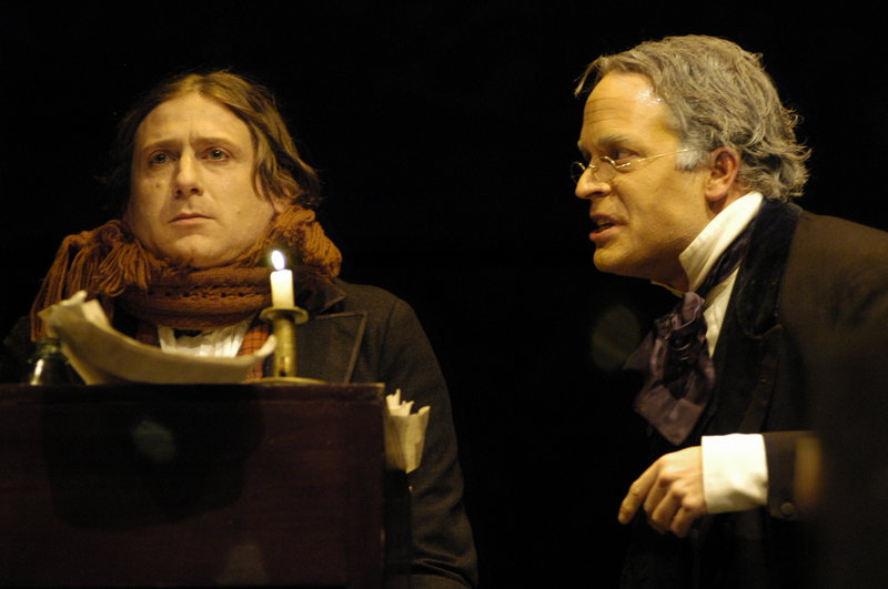 Mark Honan, left, stars as Bob Cratchit and Tom Ford is Scrooge in Portland Stage Company’s “A Christmas Carol.”