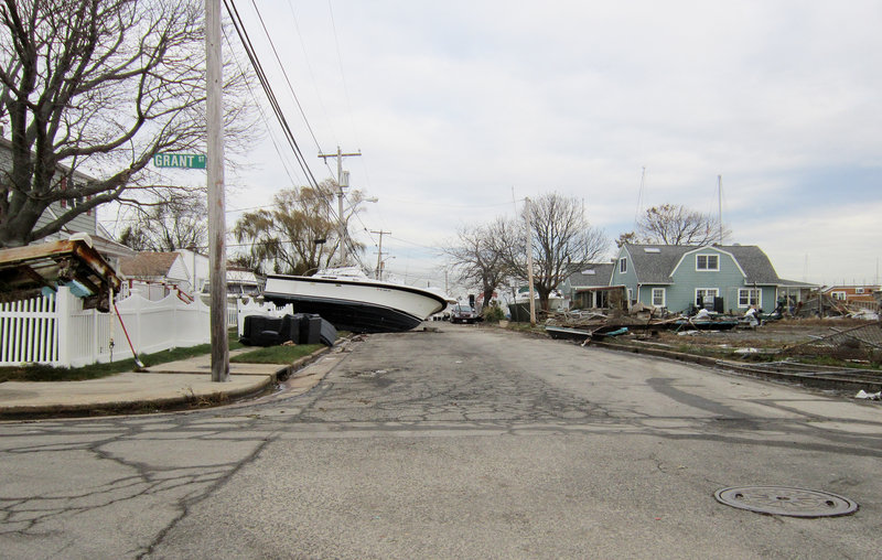 A boat rests on property several blocks inland in a seaside neighborhoods of Freeport, N.Y., in the wake of Superstorm Sandy, which hit the Northeast on Oct. 29.