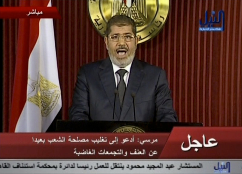 Egyptian President Mohammed Morsi delivers a televised statement in Cairo, Egypt, on Thursday, in which he refused to make any concessions to his opponents.