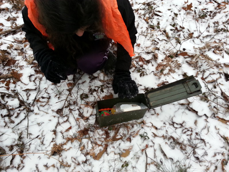 My family likes to use old metal ammo boxes for our geocaches. They require a little extra coaxing to open in the winter but are more durable than the plastic variety that many geocachers use for their hides.