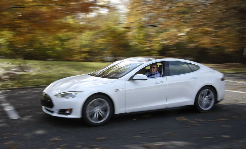 Peter Spirgel, an attorney, drives his new electric car, a Tesla Model S Performance, last month in Cherry Hill, N.J.