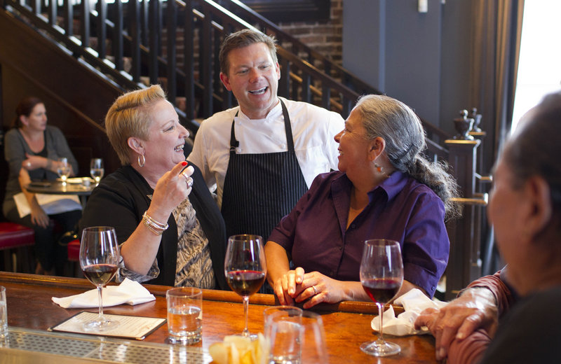Tyler Florence visits with customers at his Wayfare Tavern in San Francisco.