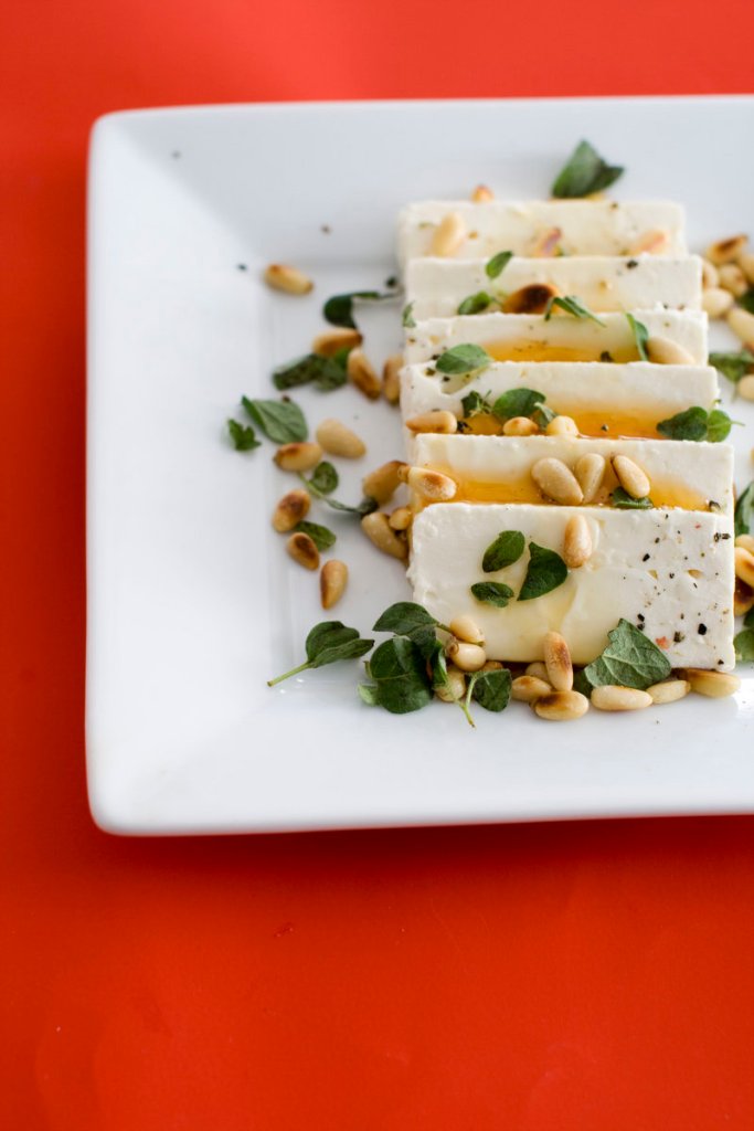 Feta cheese and honey go nicely with baguette slices.