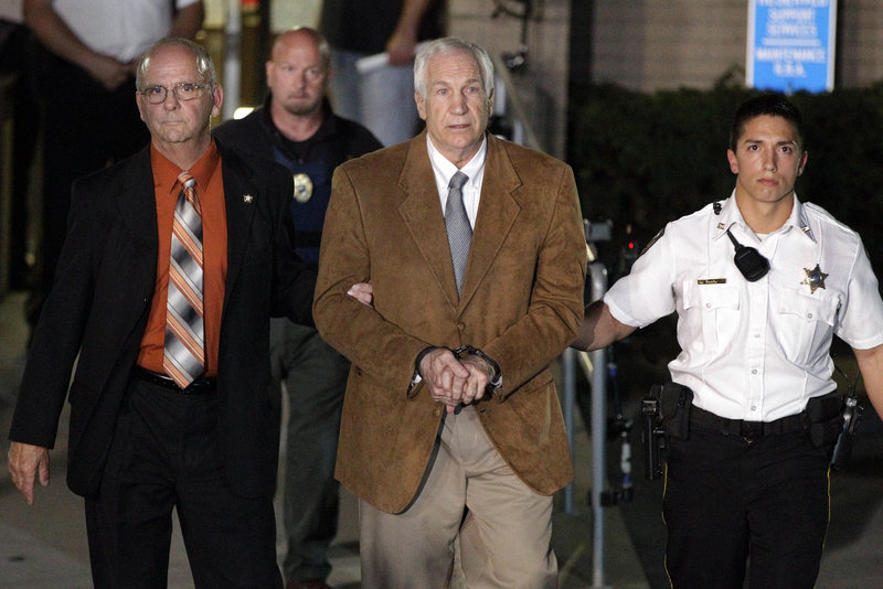 Ex-Penn State assistant football coach Jerry Sandusky leaves court after being found guilty of multiple charges of child sexual abuse.