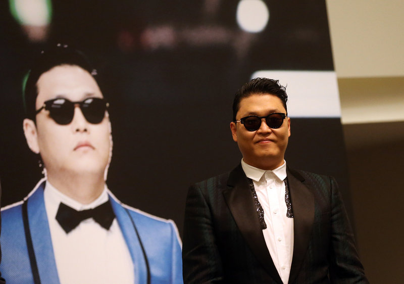 PSY, who gained popularity from his song “Gangnam Style,” talks to the media in Singapore.