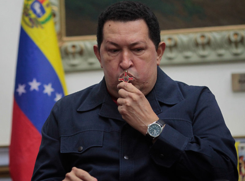 Venezuela's President Hugo Chavez kisses a crucifix during a televised speech from Caracas on Saturday.
