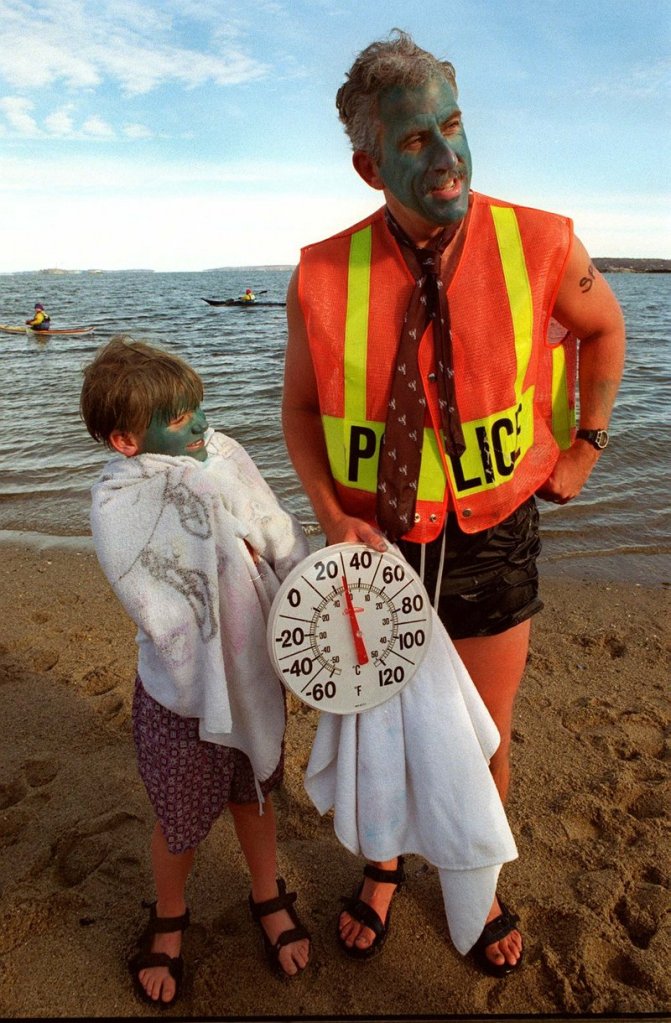 Peter MacVane and his son Ian, then 7, take part in a New Year’s Day plunge for charity in 1997.