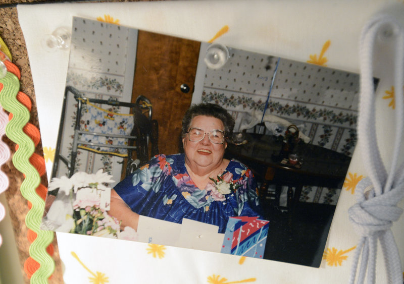 A photograph of Dot Delano, the grandmother who inspired Ivy’s bag making, hangs on a board in her workshop.