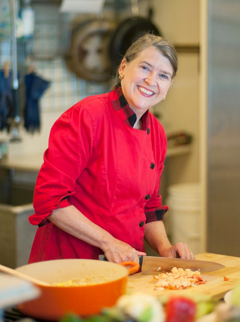 Cheryl Wixson in the kitchen of her Bangor home, which has been transformed into the headquarters of her company that produces hand-crafted prepared foods such as pasta sauce, applesauce, ketchup, relish and jams in small batches using all Maine ingredients.