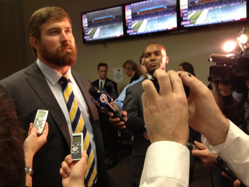 Matt Light, a former lineman for the Patriots, speaks to reporters before the game Monday. Light was honored at halftime for his contributions to a team that dominated the AFC East during his 11-year career.