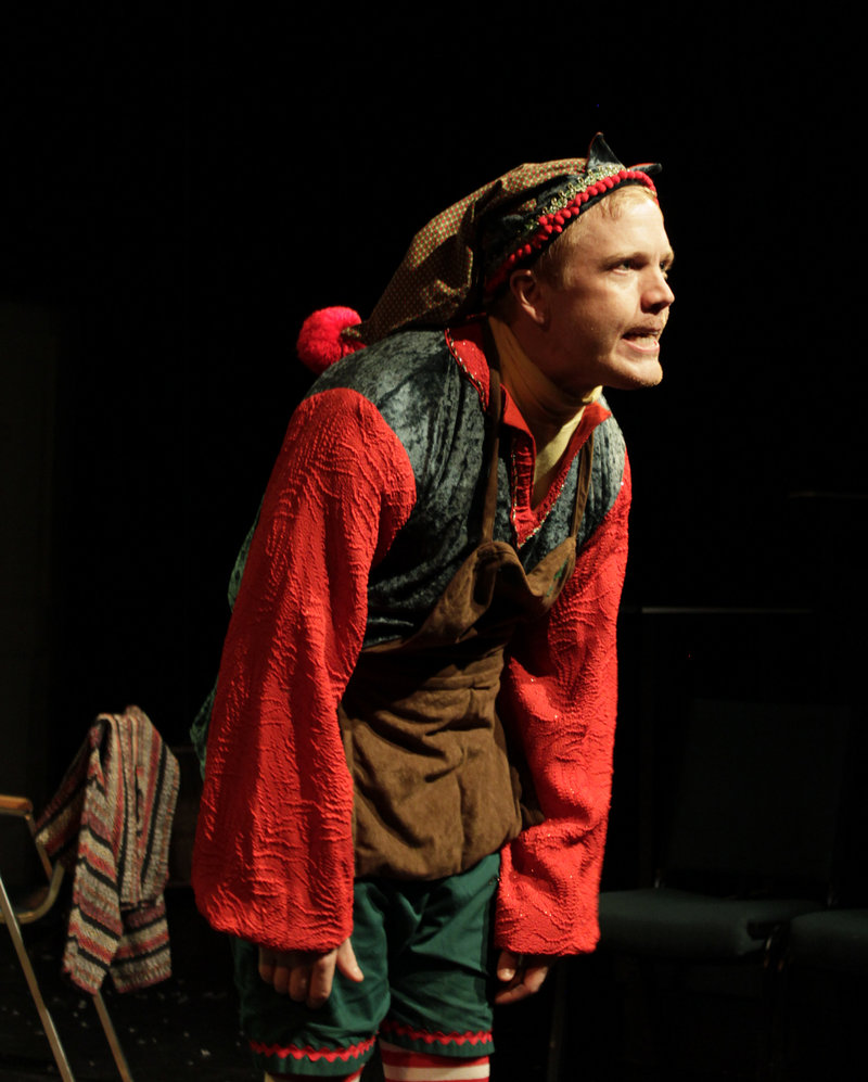 Dustin Tucker as the disgruntled department-store elf Crumpet in “The Santaland Diaries,” which concludes its holiday run at Portland Stage Company on Sunday.