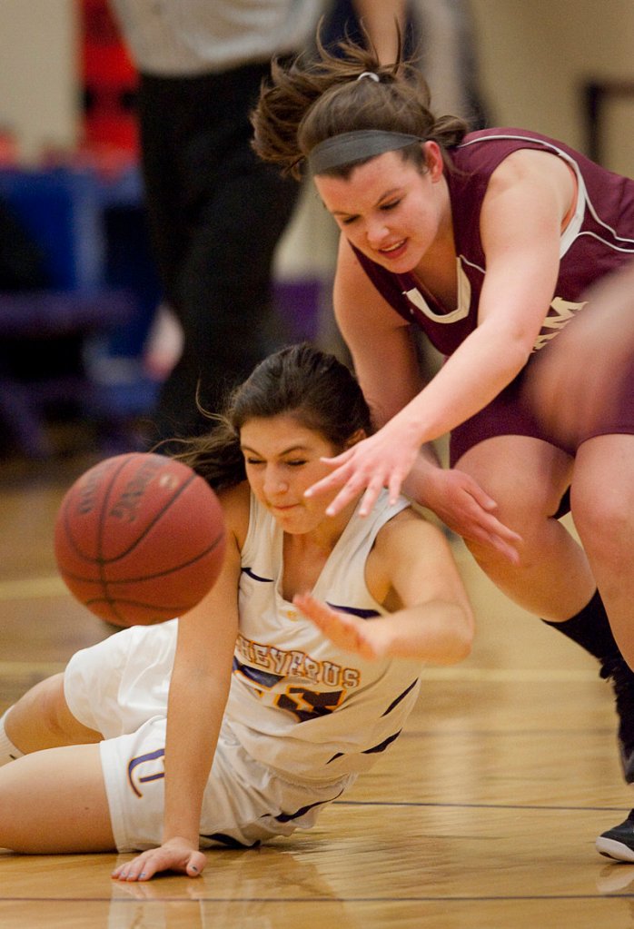 Victoria Nappi of Cheverus, left, and Abby Hamilton of Gorham have their eyes set on a loose ball. Cheverus improved to 2-0; Gorham fell to 0-2.