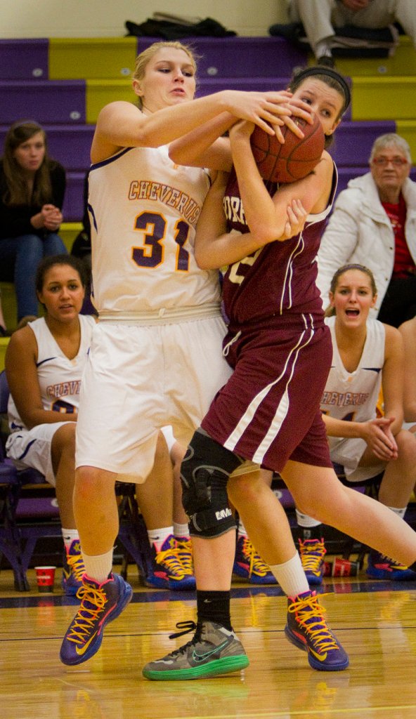 Cassidy Grover of Cheverus, left, and Molly Merrifield of Gorham compete for a loose ball Tuesday night.