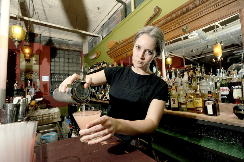 Bartender Mariah Bergeron pours a Caricature cocktail at Local 188 in Portland.